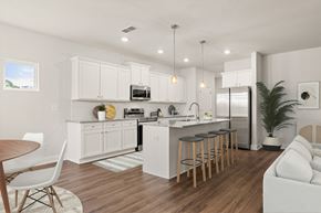 Mcdonough townhouse for rent - Spacious kitchen with an island, ample storage, and stainless steel appliances.