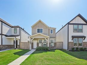 Katy apartment for rent - a row of houses with a sidewalk and lawn