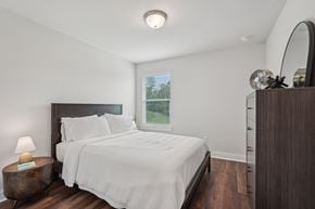 Cartersville townhouse for rent - Third bedroom with a queen-size bed and abundant natural light streaming through the window.