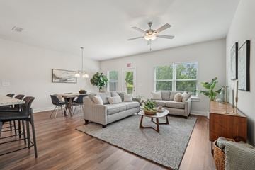 Cartersville townhouse for rent - A living room with a dining table and a couch.