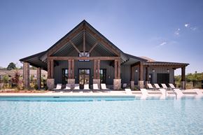 Cartersville townhouse for rent - Resort-style pool with ample seating, lounge chairs and umbrellas.