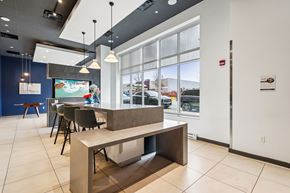 Pittsburgh apartment for rent - A modern dining area with a long table and chairs.