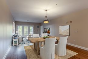 Highland apartment for rent - A dining room with a wooden table and chairs.