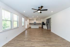 Grayson apartment for rent - Spacious kitchen offering an elegant path to the stairwell.