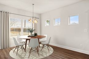 Mcdonough townhouse for rent - Elegant dining area bathed in natural light.