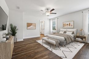 Hoschton townhouse for rent - Primary Bedroom with king size bed and large window letting in nice natural light.