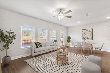 Loganville townhouse for rent - a living room with a couch and a ceiling fan