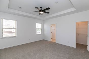Tray ceiling in primary bedroom