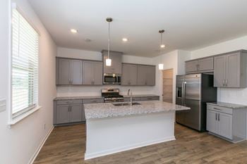 Stone grey shaker style cabinets with brushed nickel hardware