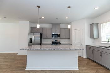 Stone grey shaker style cabinets with brushed  nickel hardware