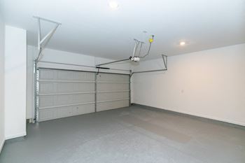 Two car attached garages with remote and app  control