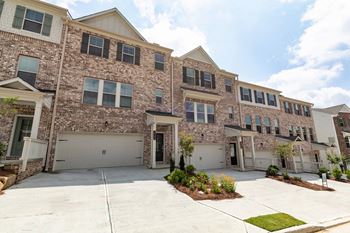 Professionally landscaped with sidewalks throughout