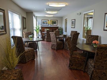 West Chester apartment for rent - A living room with brown patterned chairs and a wooden floor.
