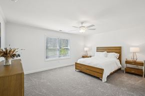 Powder Springs apartment for rent - Primary Bedroom with king size bed and large window letting in nice natural light.