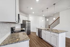 Loganville townhouse for rent - A view of the spacious kitchen and stainless steel appliances