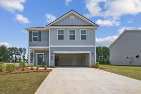 Hoschton townhouse for rent - Exterior of the Rosewood, two story home with a private driveway and attached garage.