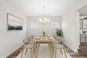 Jefferson apartment for rent - Elegant dining room featuring a rich wooden table and timeless seating—designed for unforgettable family gatherings.
