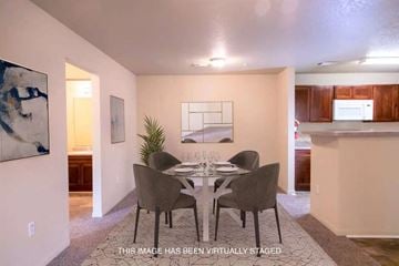 Tuscaloosa apartment for rent - A dining room with a table set for four.