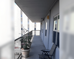 Meridian apartment for rent - a balcony with a chair and plants on it