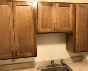 Meridian apartment for rent - a kitchen with wooden cabinets and a sink