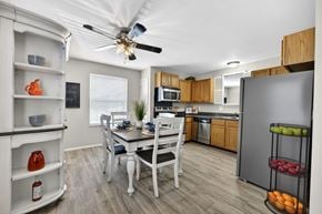 Arnold apartment for rent - A kitchen with a table and chairs in the middle of the room.