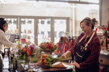 Retail tenants include a small grocery, coffee shop and roastery, bakery, pharmacy, and several restaurants