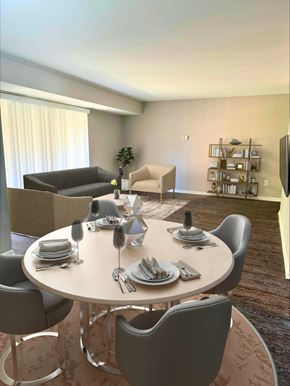 Gaithersburg apartment for rent - A modern dining room with a round table set for six.