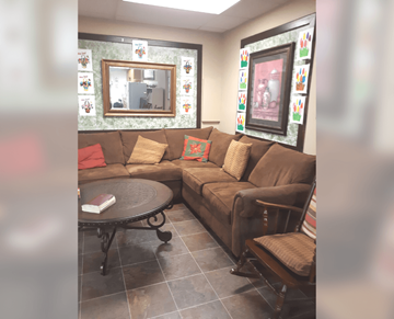 Meridian apartment for rent - A living room with a brown couch and a round table.