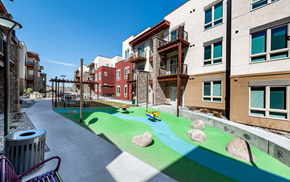 Denver apartment for rent - a view of a playground in the middle of an apartment building