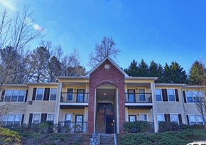Blairsville apartment for rent - a view of an apartment building with a blue sky in the background