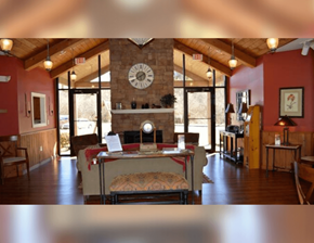 Blue Ridge apartment for rent - a living room with a fireplace and a clock on the wall