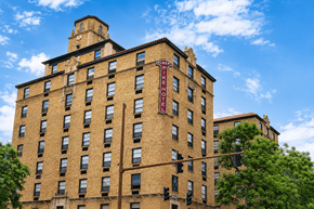 Little Rock apartment for rent - A tall brick building with a clock tower on the top.