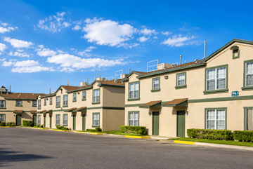 El Paso apartment for rent - Apartment complex with a parking lot in front.