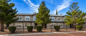 El Paso apartment for rent - A row of houses with trees in front.