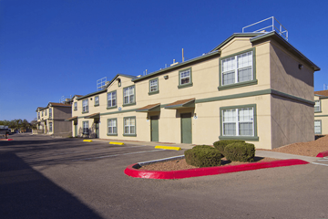El Paso apartment for rent - A row of apartment buildings with a red circle in the middle of the parking lot.