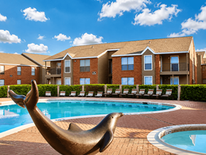 Houston townhouse for rent - A seal statue is in front of a pool at a residential complex.