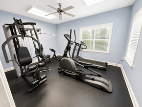 Sanford apartment for rent - A home gym with a variety of exercise equipment.