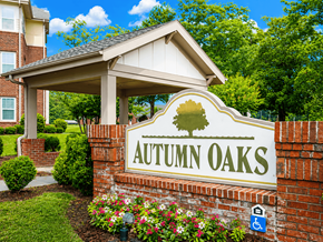 Sanford apartment for rent - A sign that says Autumn Oaks in front of a building.