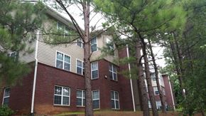 Dalton apartment for rent - an apartment building with trees in front of it