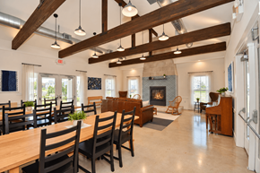 Haslet apartment for rent - A clubhouse with large dining room with wooden chairs and a fireplace.