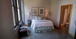 St. Louis apartment for rent - a bedroom with a bed and a large window