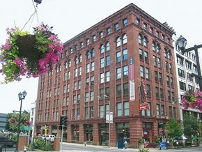 St. Louis apartment for rent - a large brick building on the corner of a city street