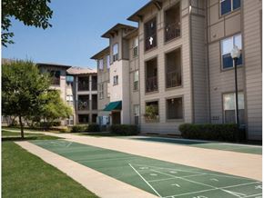 Dallas apartment for rent - a basketball court in front of an apartment building