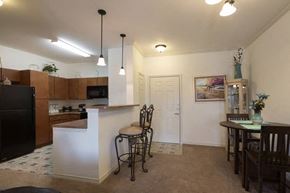 Dallas apartment for rent - a kitchen with a bar and a dining table