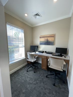 Greenville apartment for rent - an office with two desks and two computers and a window