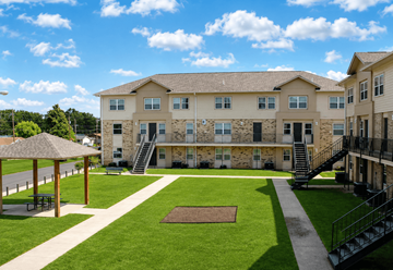 Shreveport townhouse for rent - A large building with a gazebo in front of it.