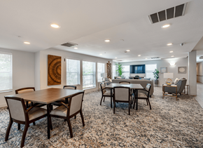 Denver apartment for rent - A dining room with a large table and chairs.