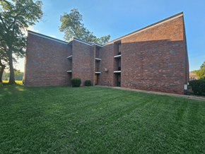 Columbus apartment for rent - the side of a brick building with green grass