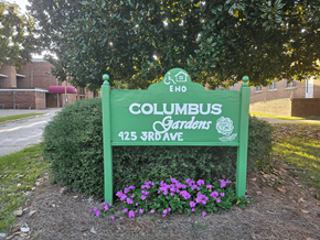 Columbus apartment for rent - a sign gardens in front of a tree
