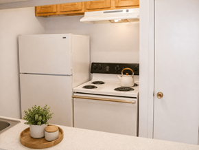 Houston apartment for rent - A white refrigerator and stove in a kitchen.